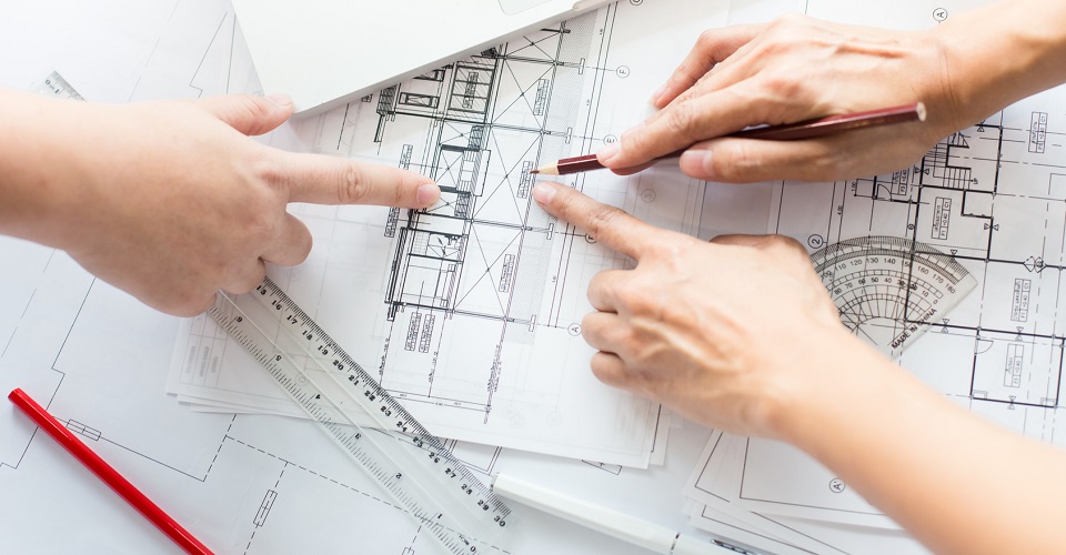 hands pointing at a design drawing